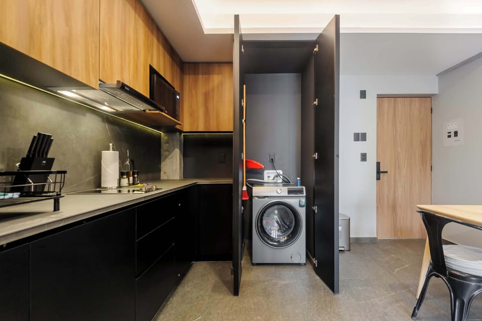 Fully equipped kitchen with washer for added convenience.
