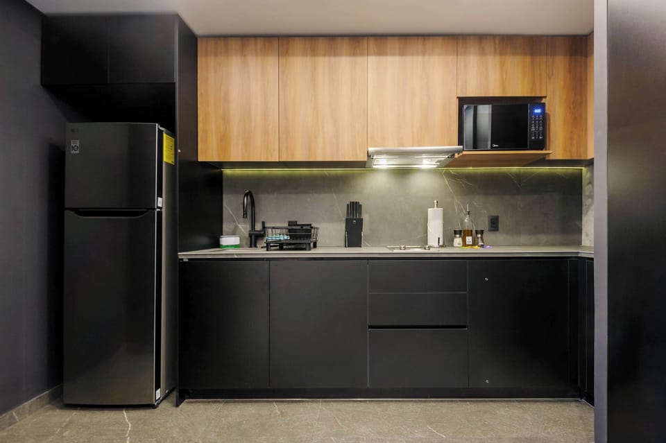 Fully equipped kitchenette with modern appliances.