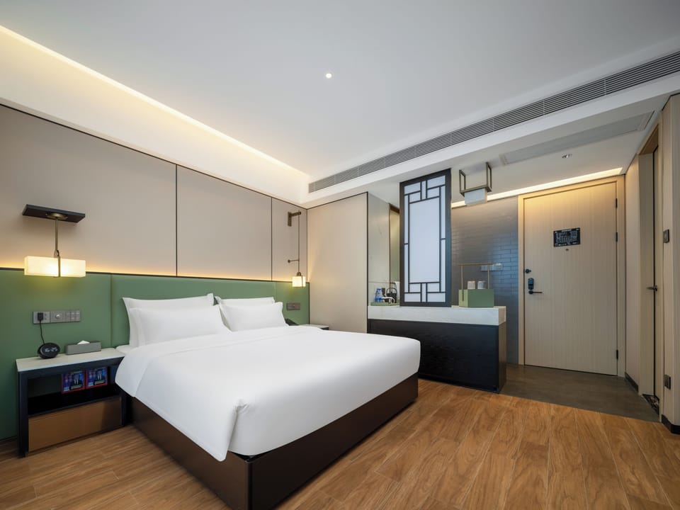 Basic Single Room, 1 Queen Bed, Housekeeping, City View | Blackout drapes, iron/ironing board, free WiFi