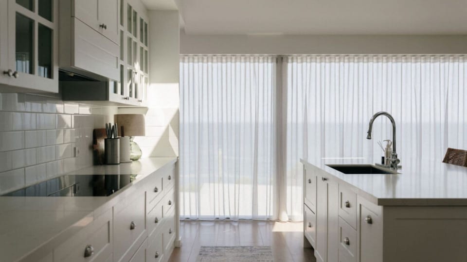 Light-filled kitchen with quality appliances and ample storage.
