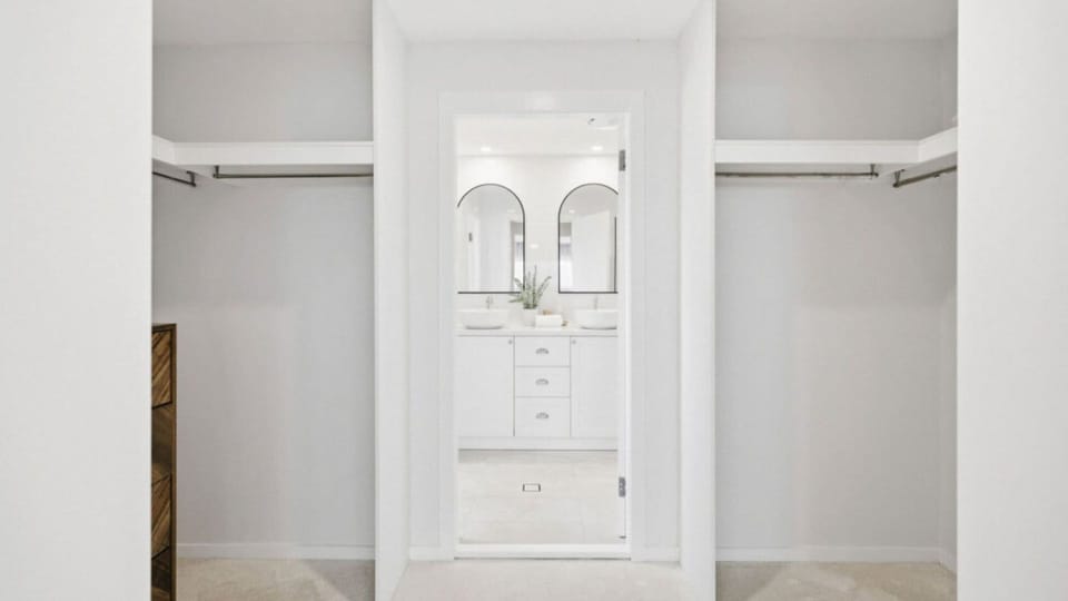 Walk-in wardrobe leading to the ensuite bathroom.