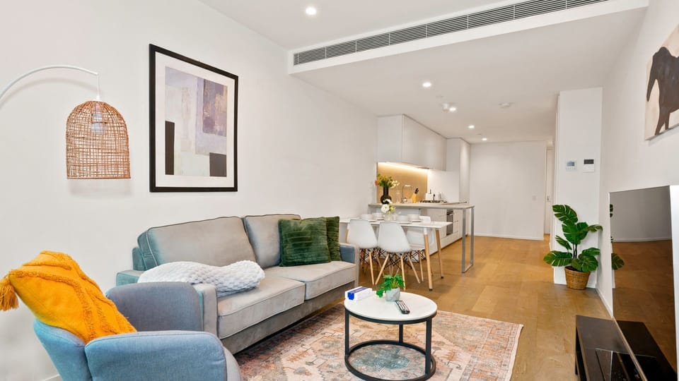 Sophisticated open-plan living with warm designer accents.
