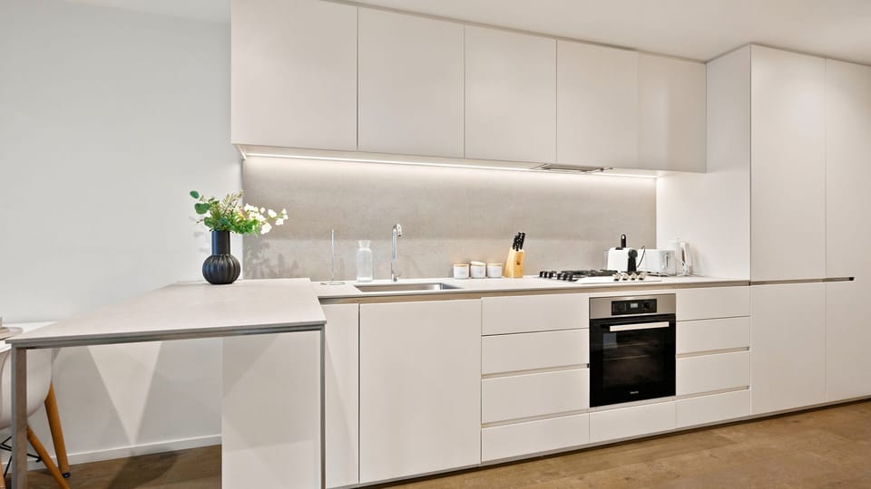 Contemporary kitchen featuring premium appliances and minimalist design.