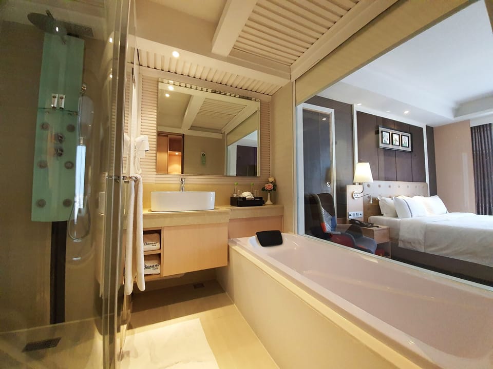 Deluxe Room Carpet | Bathroom | Free toiletries, hair dryer, bathrobes, slippers