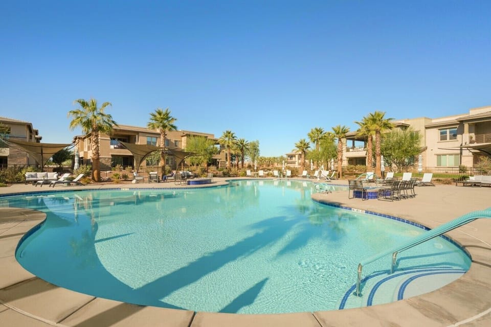 Resort style communal pool with lounging area