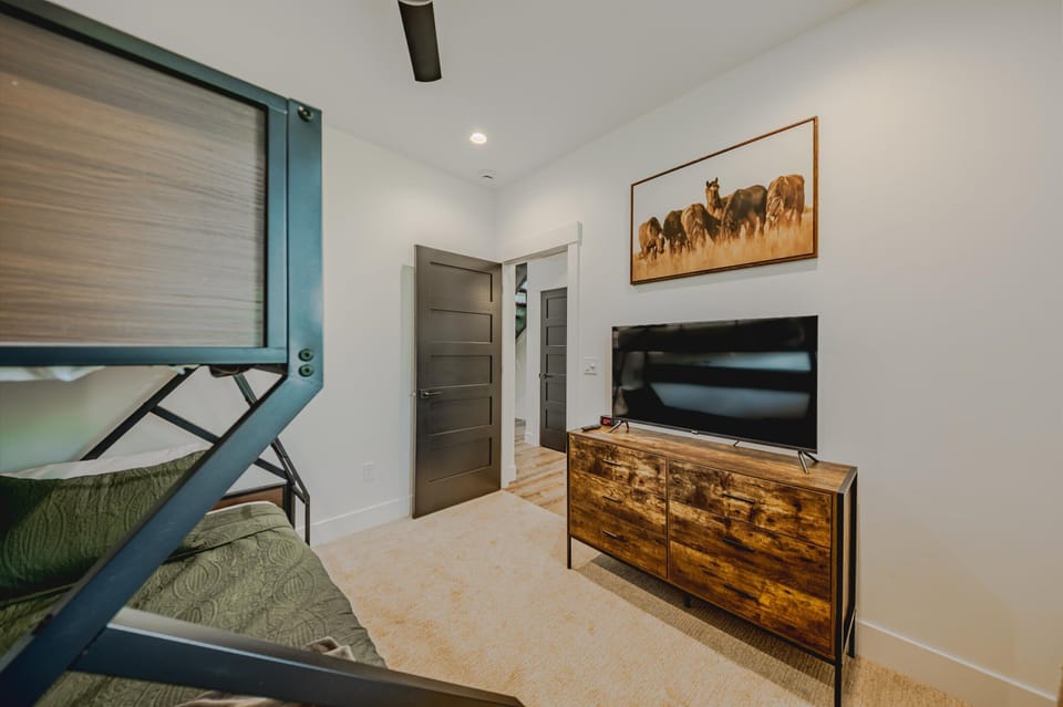 Bedroom 2 with twin/full bunk bed and Smart TV