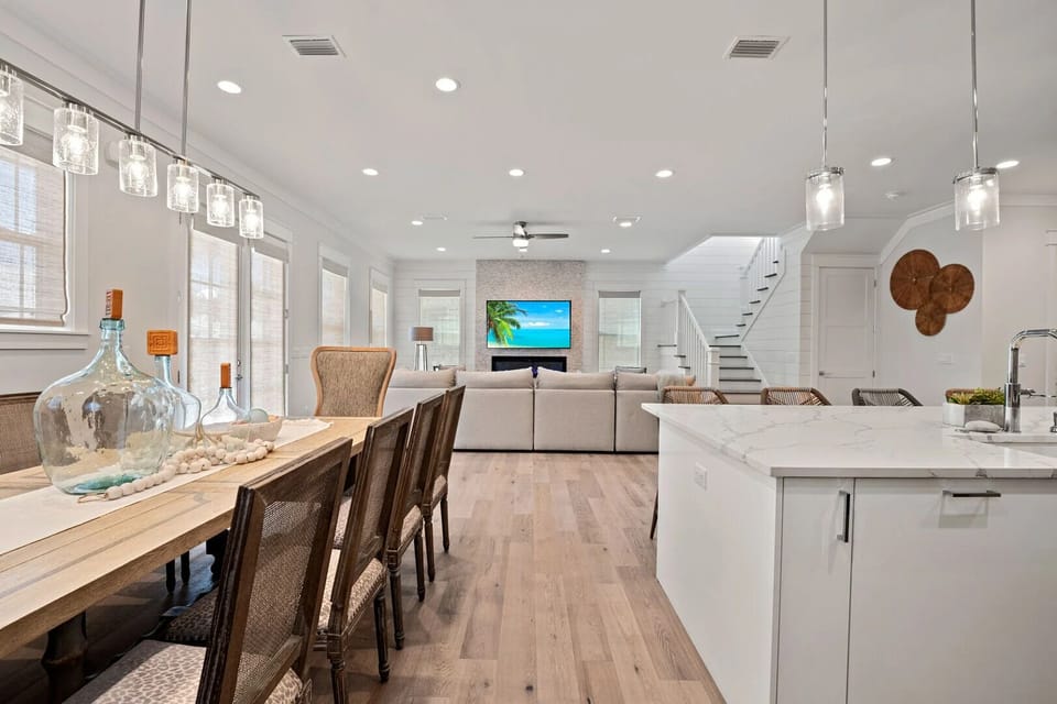Open layout connects kitchen, dining, and living areas.