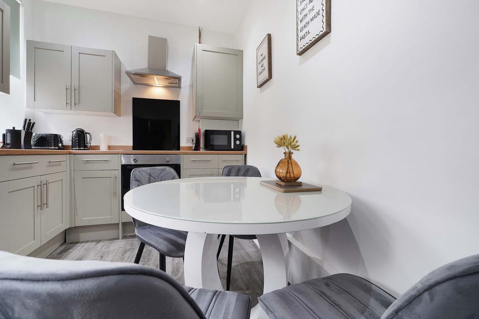 Right in the heart of the kitchen, this cosy dining setup seats four perfectly. Whether you're gathering for a home-cooked dinner, sipping morning coffee, or mapping out the day's adventures, it's the ideal social hub.