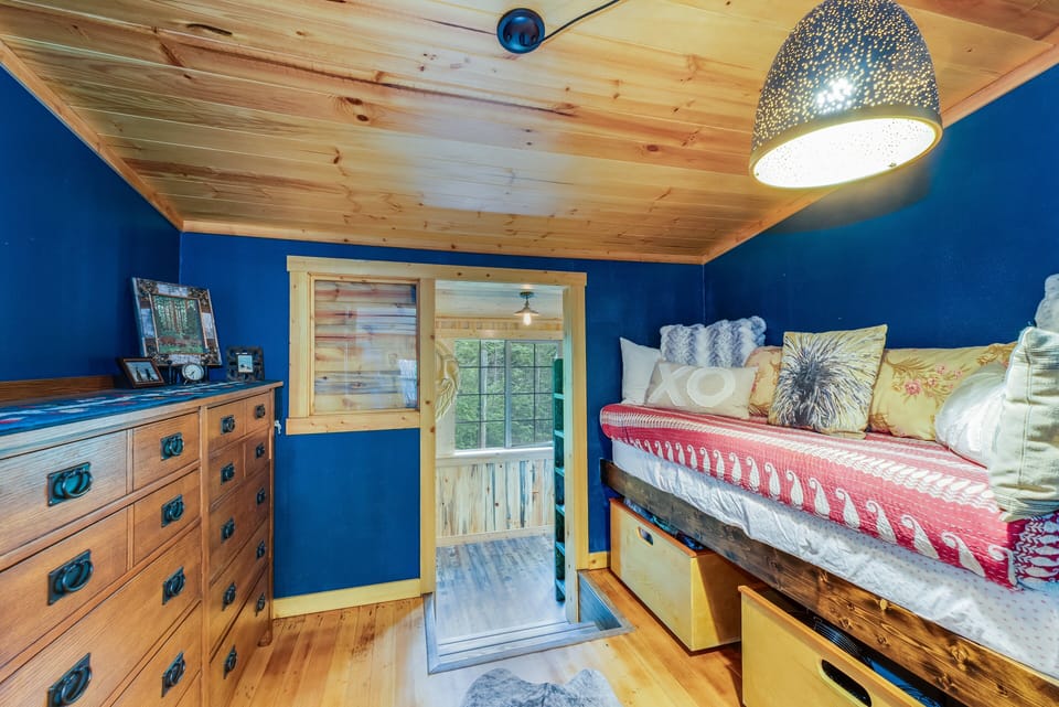 Twin size bed with dressers. | Main Level