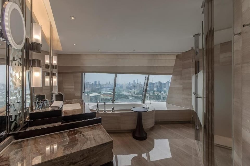 Separate tub and shower, free toiletries, hair dryer, slippers