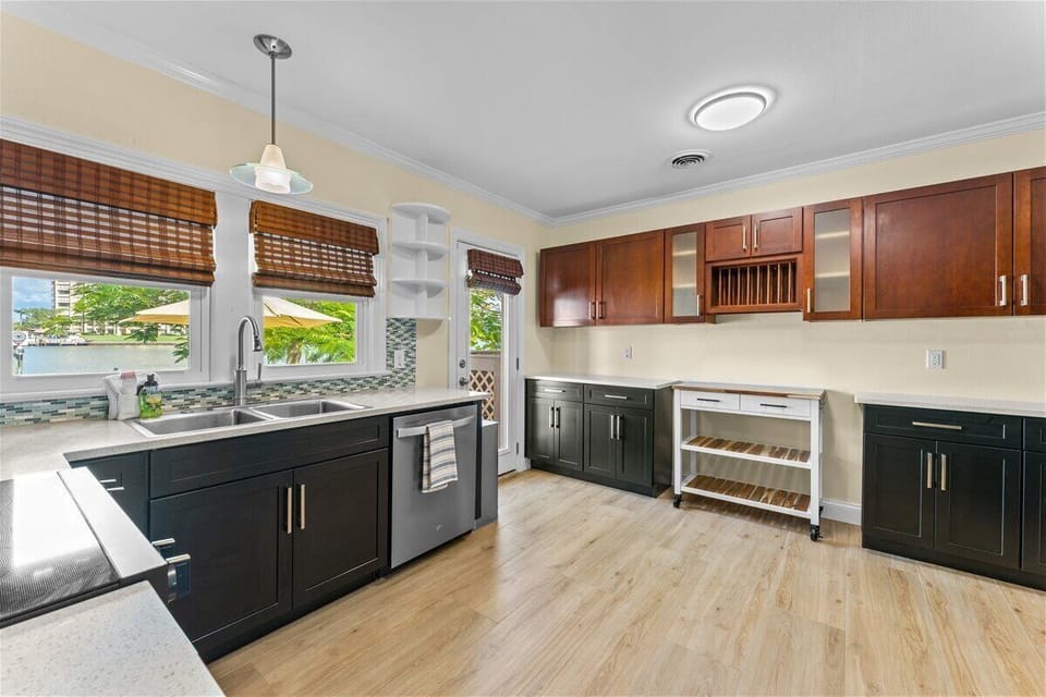 The fully equipped kitchen provides everything needed for long-term stays, including ample counter space, modern appliances, and convenient seating for casual meals and entertaining.