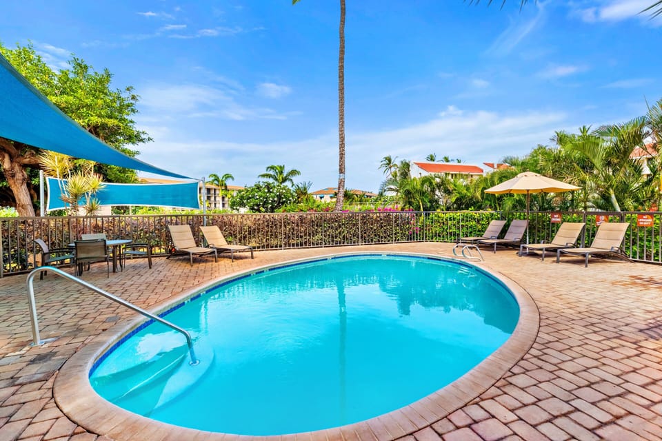 Enjoy a refreshing swim in the pool, perfect for relaxing and soaking up the Hawaiian sunshine during your getaway.