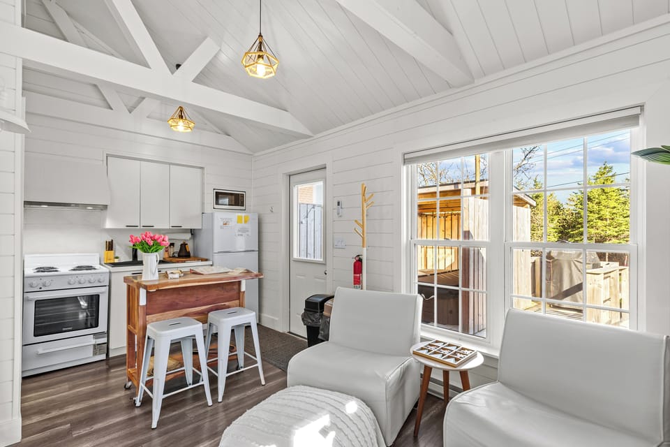 Open-concept living area with deck access and peaceful views