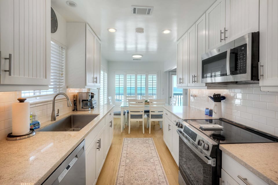Kitchen with dining and ocean views
