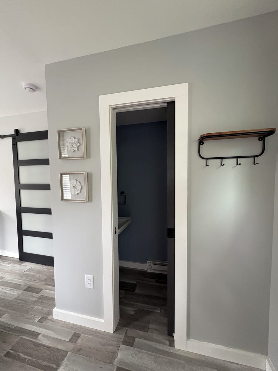 Side entry, opens to living area and half bath 
