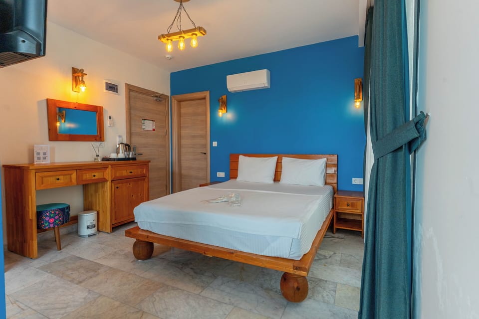 Triple Room, Sea View | Blackout drapes, iron/ironing board (on request), WiFi (free)