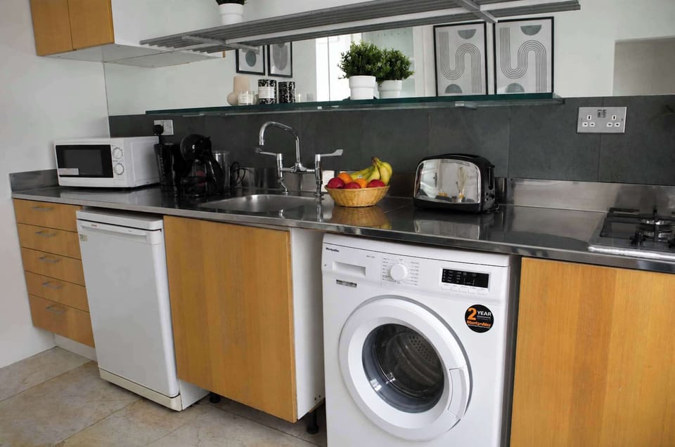 The kitchen is fully equipped to prepare a simple meal 