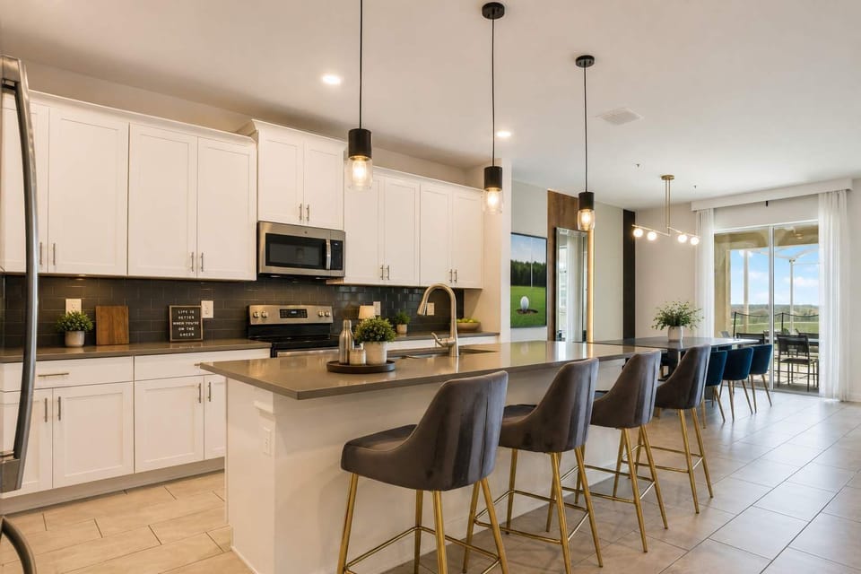 Bring everyone together in this spacious gourmet kitchen. Prepare family meals, share morning coffee, and create unforgettable memories with friends around the large island and elegant dining area.