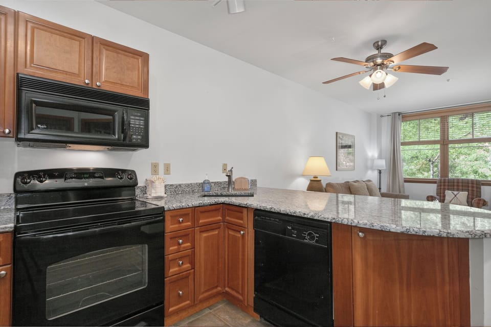 Your open kitchen features granite countertops, modern appliances, and a bright living space that flows seamlessly together—perfect for cooking and relaxing after a day of adventure.