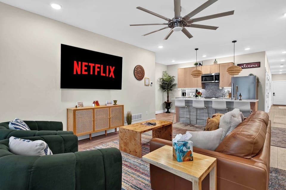 Living Room - Unit 1: Relax in this bright and cozy living room featuring comfortable seating, tasteful décor, and a welcoming atmosphere perfect for unwinding after a day of exploring.