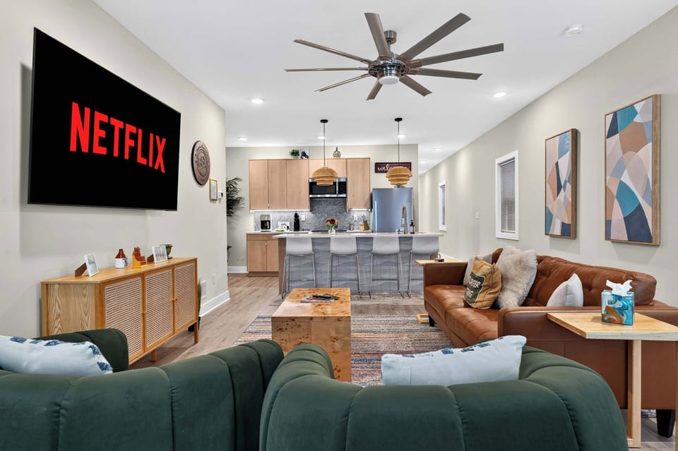Living Room - Unit 1: Relax in this bright and cozy living room featuring comfortable seating, tasteful décor, and a welcoming atmosphere perfect for unwinding after a day of exploring.