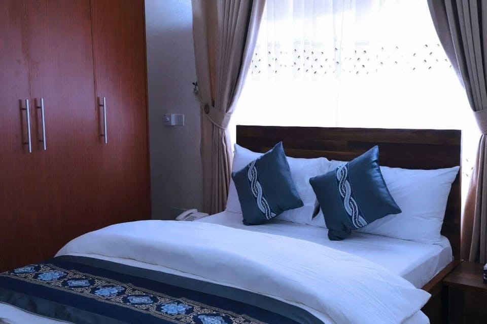 Standard Double Room, Balcony, Garden View | In-room safe, desk, laptop workspace, blackout drapes
