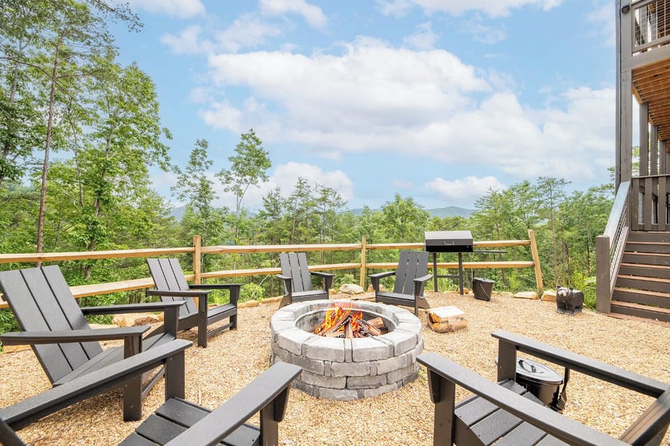 Gather around the firepit with mountain vistas stretching before you—perfect for sharing stories under the open sky while savoring meals from the outdoor grill.