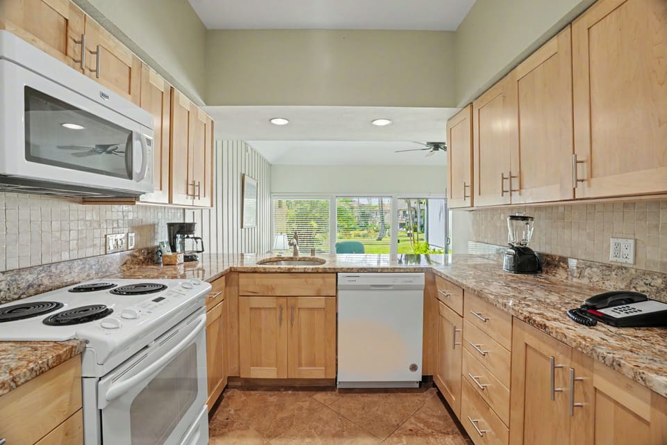 Your well-appointed kitchen offers ample counter space, modern appliances, and everything you need to feel right at home while preparing meals in this light-filled space.