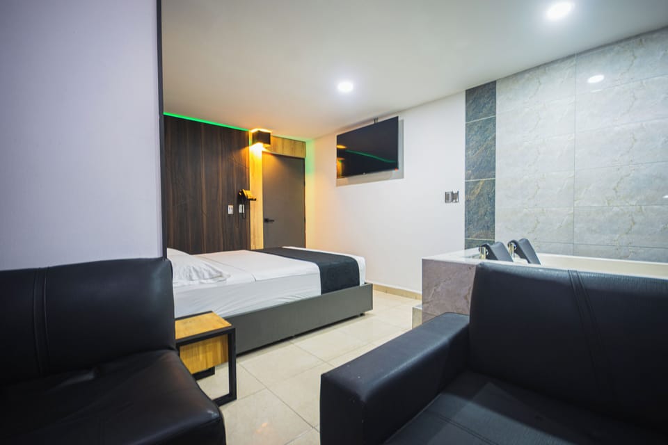 Deluxe Suite, Balcony, City View | Minibar, WiFi (free), bed sheets