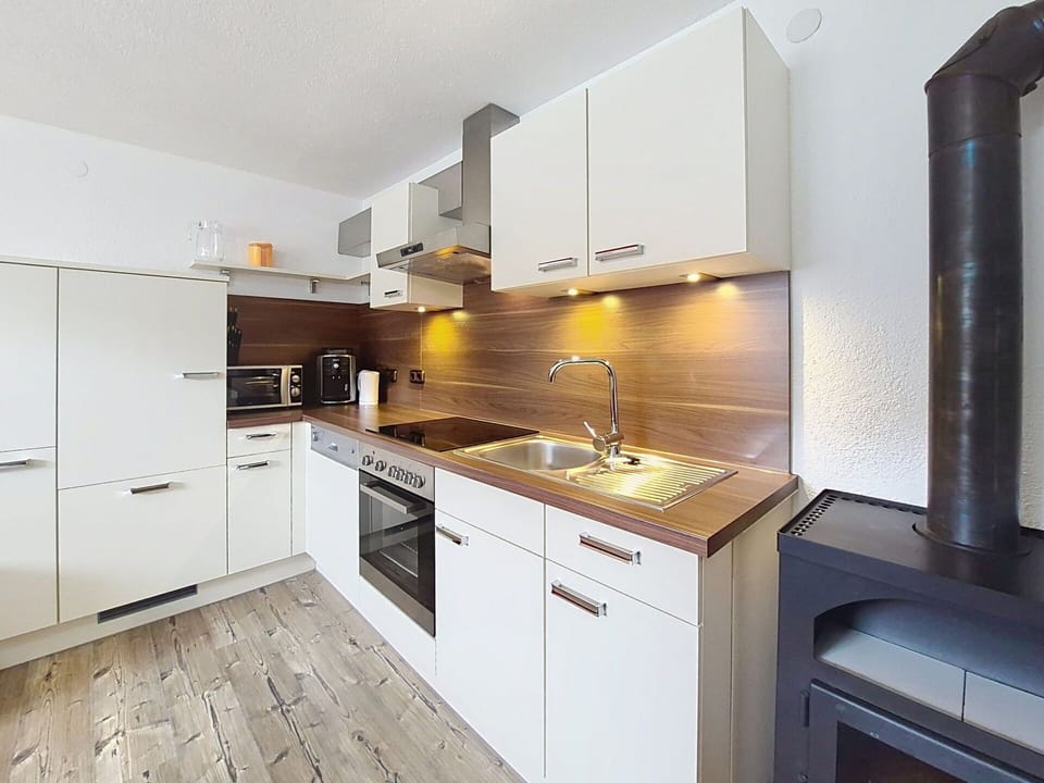 Flooring, Interior Design, Kitchen, Countertop, Wood, Floor, Cabinetry, Kitchen Appliance, Ceiling, Major Appliance