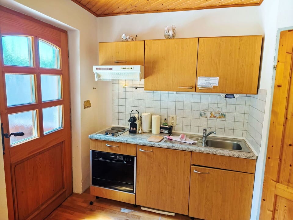 Wood, Furniture, Flooring, Cabinetry, Floor, Kitchen, Kitchen Sink, Interior Design, Sink, Plumbing Fixture