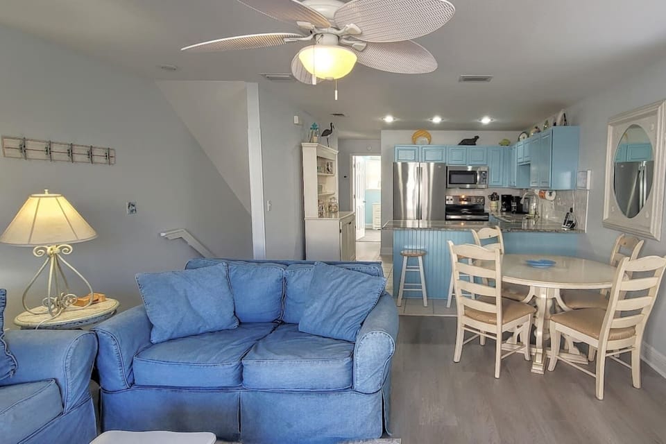 The open LVP living and kitchen area keeps the group together — easy to clean, easy to live in, easy to love.