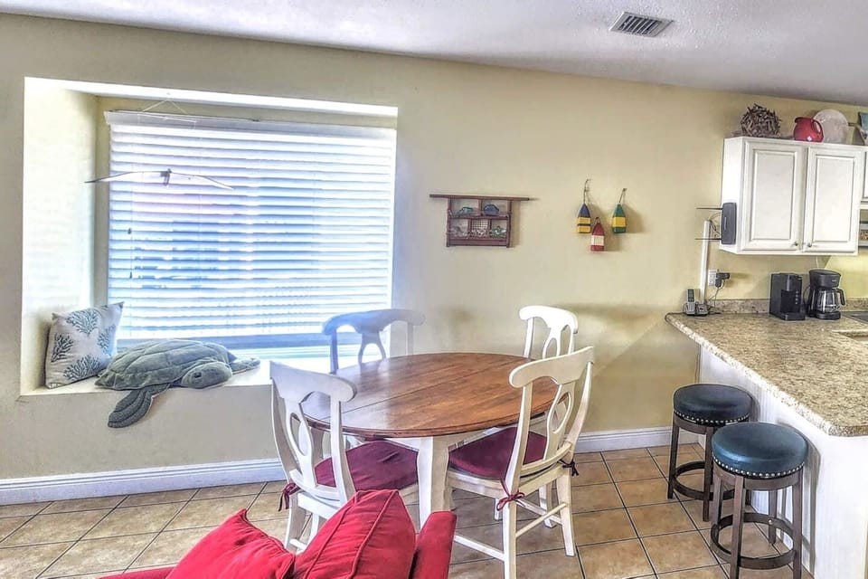 Grab the bay window seat for your morning coffee or pack everyone around the dining table for a real sit-down meal between beach days.