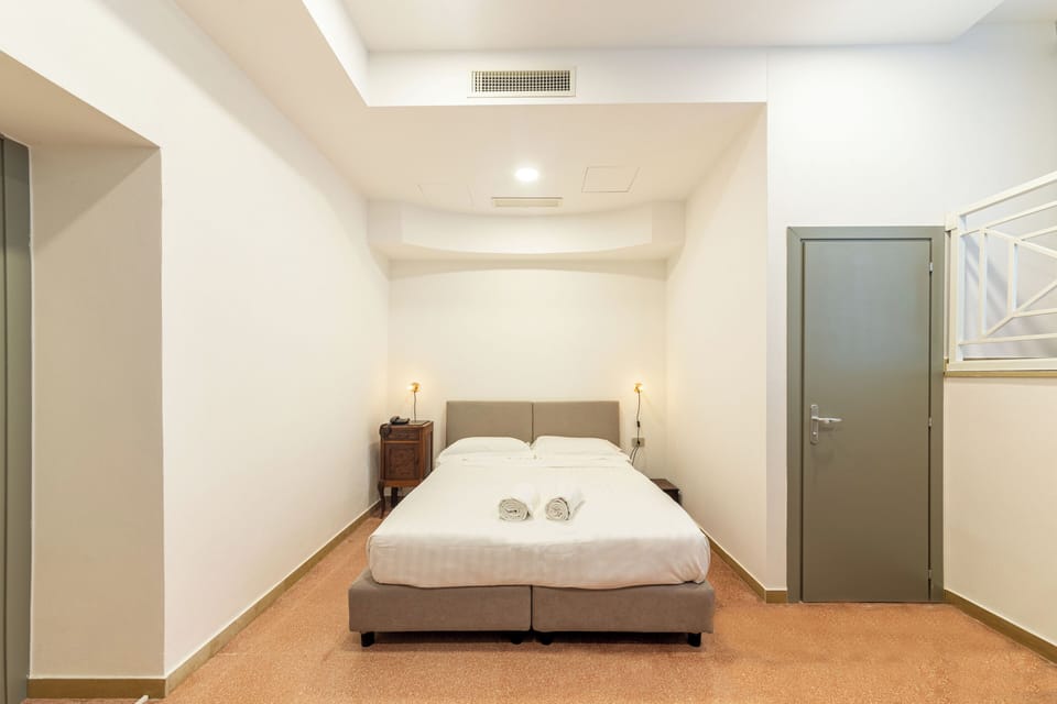 Economy Room | Desk, laptop workspace, WiFi (free), bed sheets