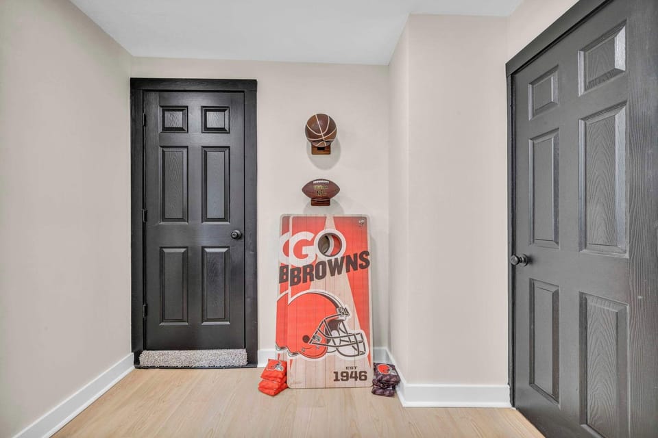 Fun entryway nook w/ Cleveland Browns decor, a playful touch for game day fans.