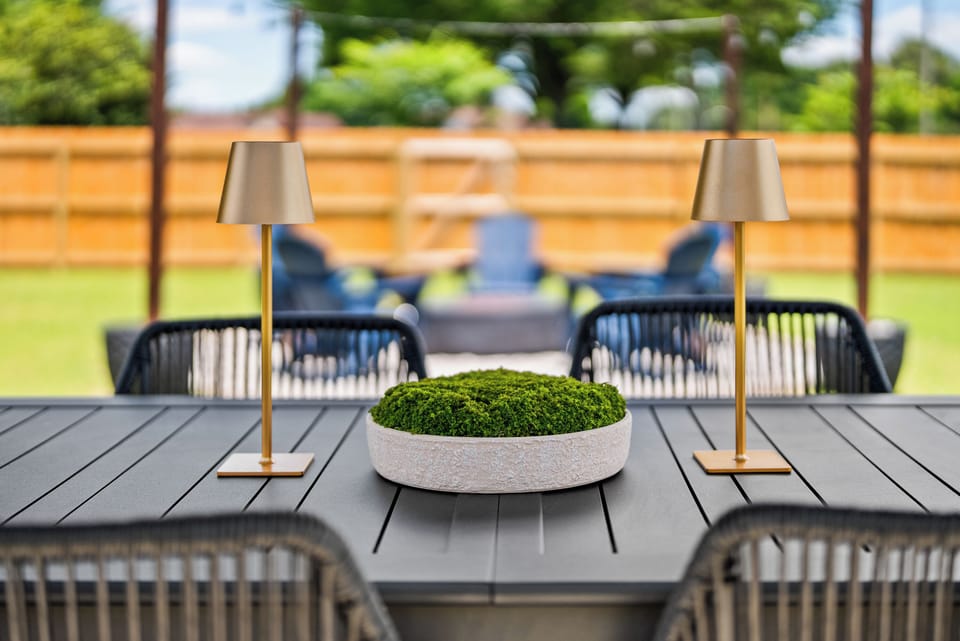 Enjoy meals outdoors with a dining set up designed for family -style gatherings.