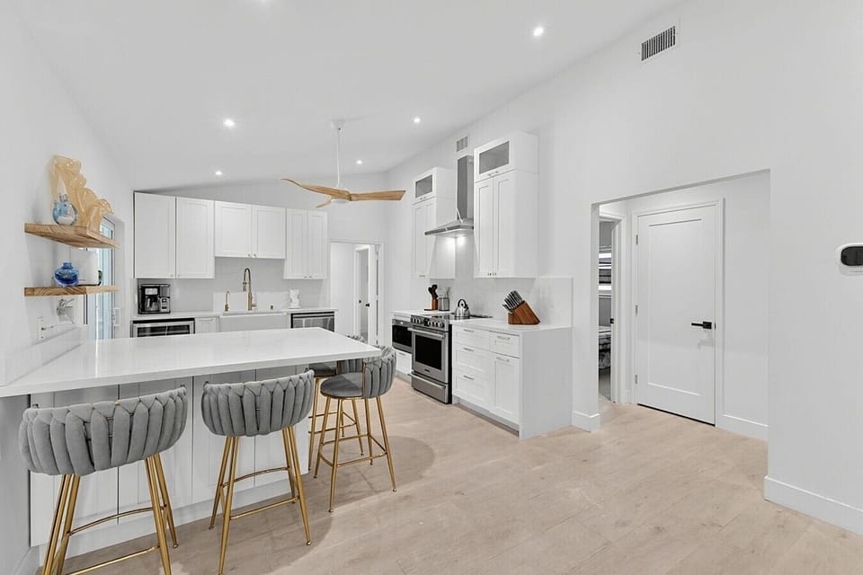 Kitchen | Electric Range & Coffee Station | Breakfast Bar Seating