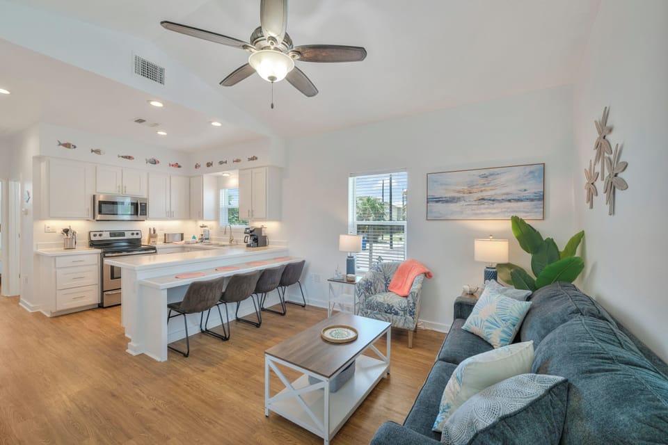 Unwind in this bright, open-concept living space where coastal charm meets modern comfort—your perfect retreat after a day of adventure.