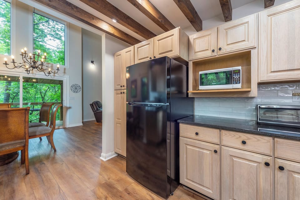 Updated kitchen, fully stocked with cooking supplies.