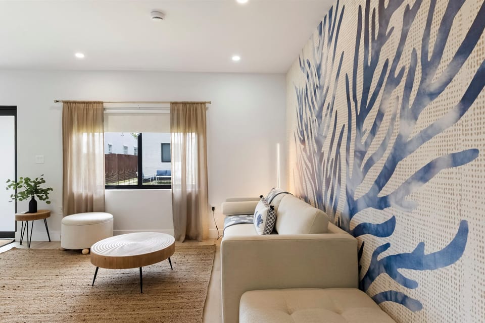 Living Room: Bright, airy space with chic decor and inviting seating for relaxation and gathering.