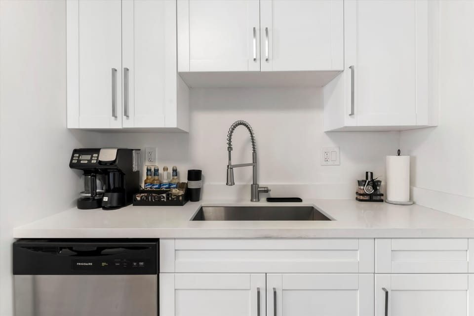 Fully Stocked kitchen with coffee station, dishwasher, oven,hob