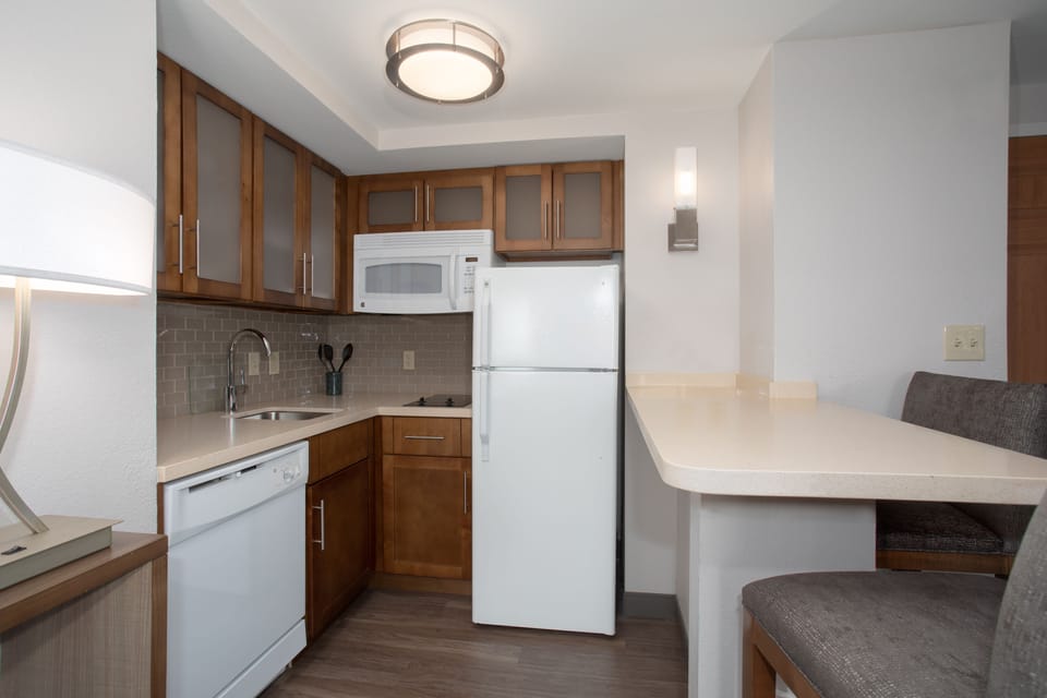 Functional kitchen with stylish finishes and breakfast bar seating.