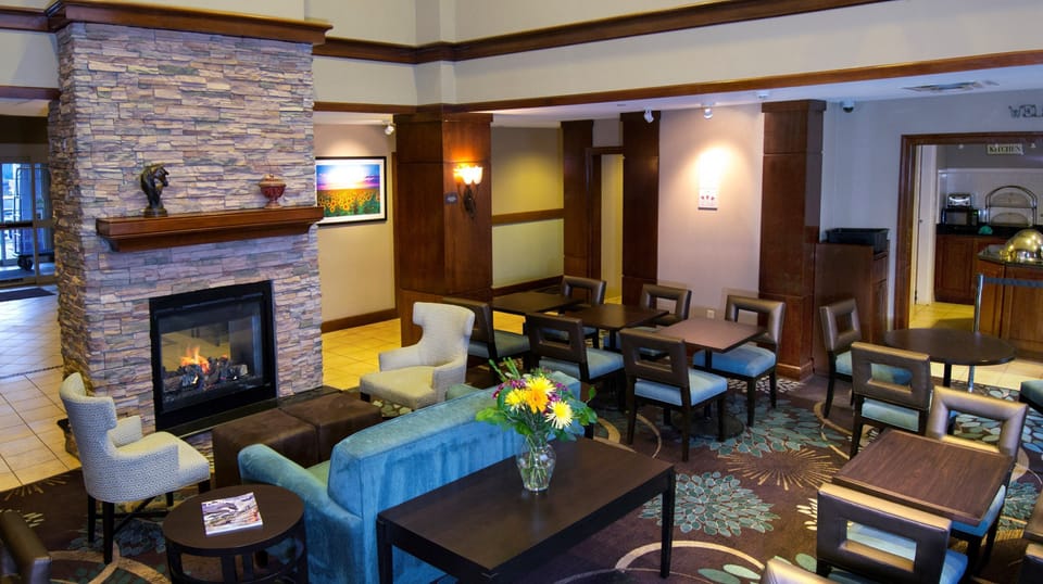 Common lounge area with fireplace and cozy seating.