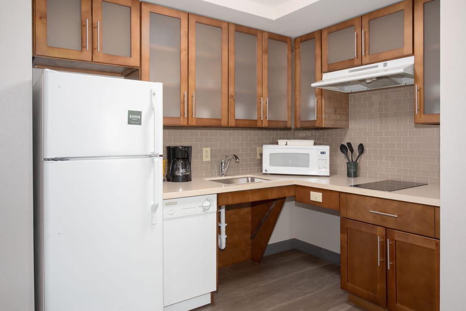 Stylish kitchen featuring essential appliances and ample storage.