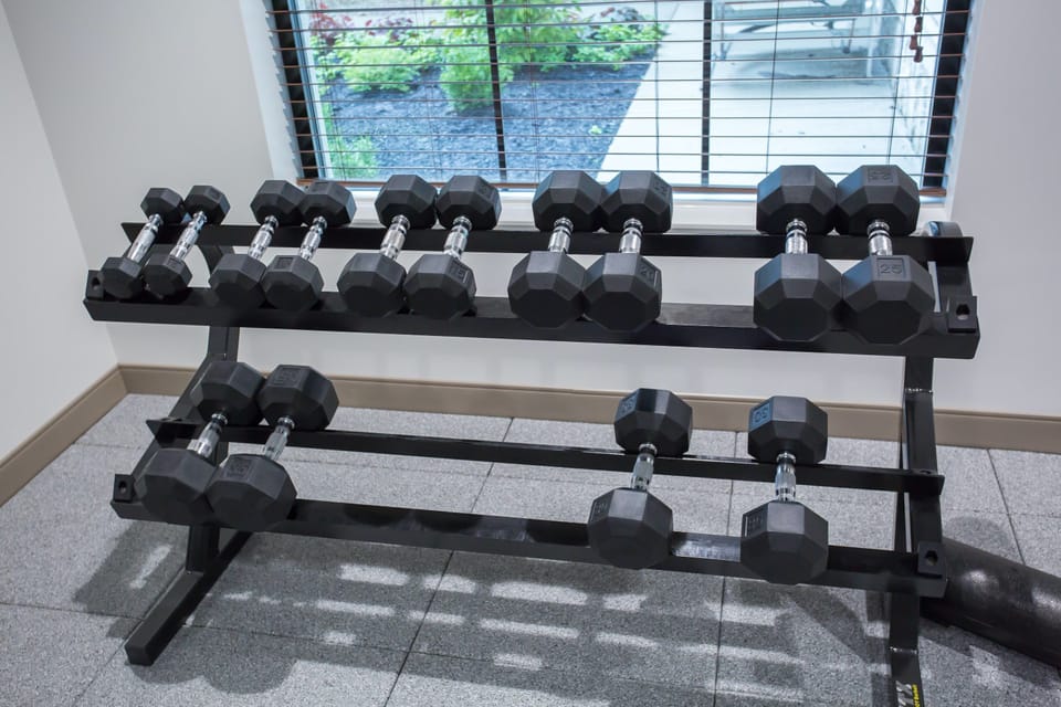 Elevate your fitness routine with a selection of dumbbells, ready for your next workout.