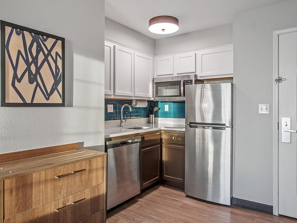 Create culinary delights in this sleek, fully-equipped kitchen with modern finishes for a perfect stay.