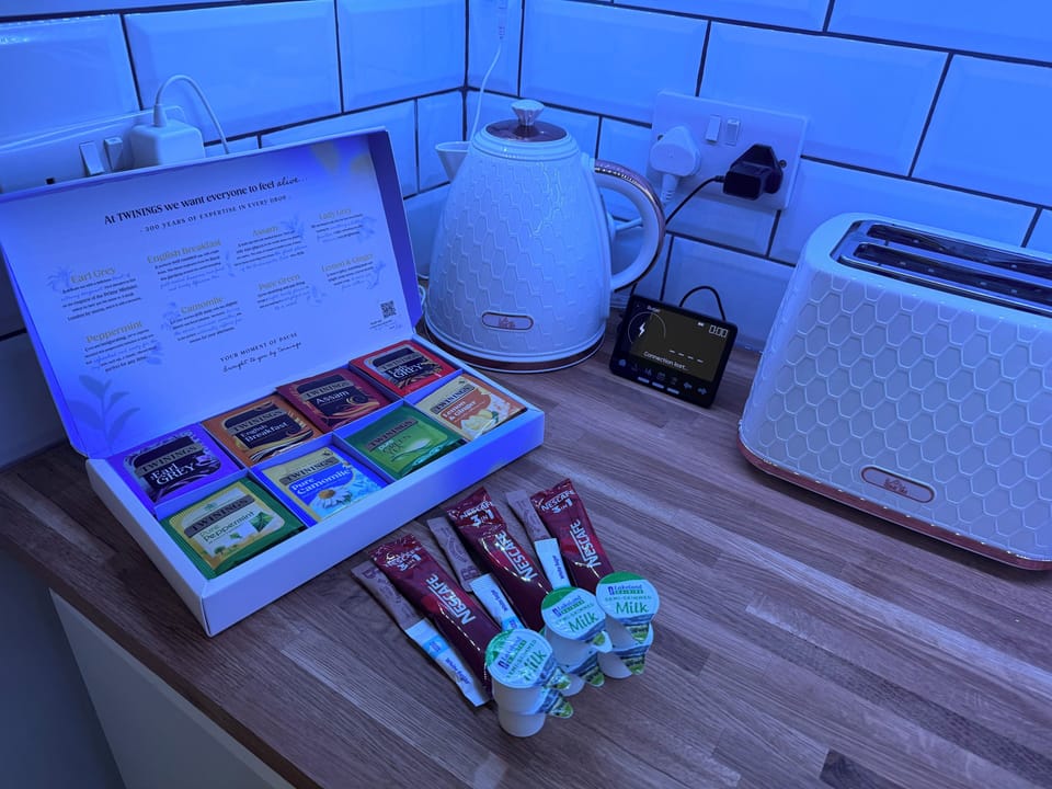 Snack area with selection of tea, coffee and cookies 