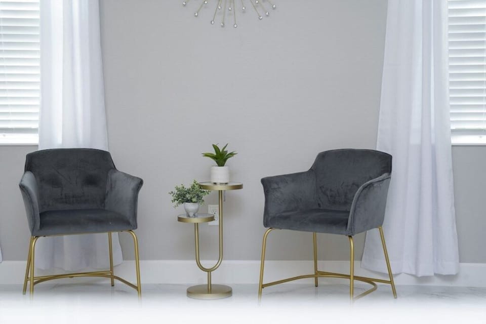 Elegant sitting area with modern accent chairs, perfect for reading, coffee, or quiet conversations