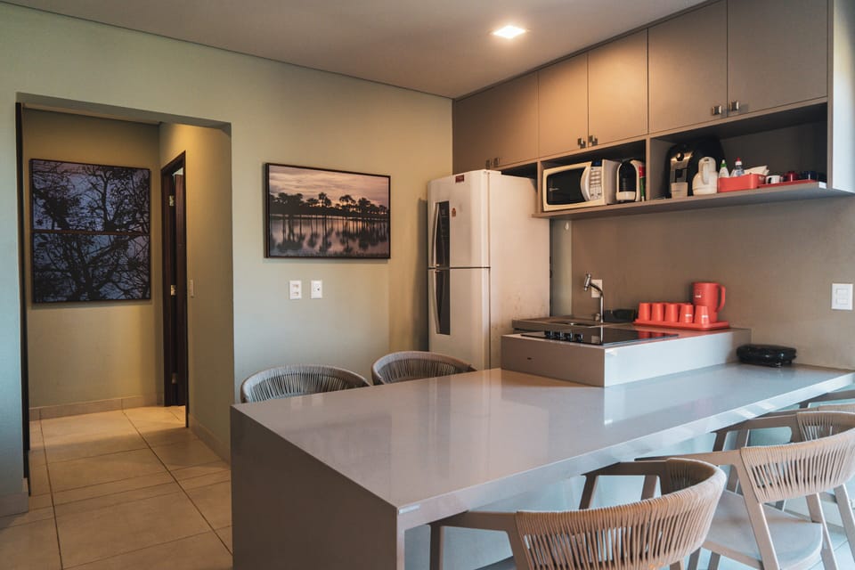 Deluxe Apartment, Pool View | Private kitchen | Mini-fridge, microwave, cookware/dishes/utensils