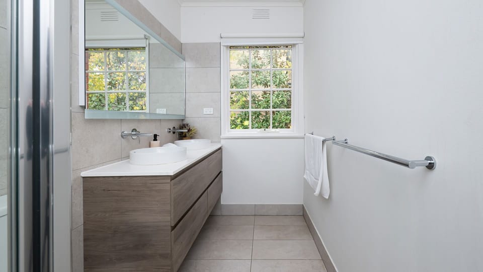 Spacious bathroom with complimentary essentials.